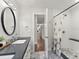 Bathroom features a double vanity, walk-in shower, and neutral color scheme at 3052 S Gilpin St, Denver, CO 80210