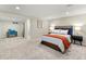 Finished basement bedroom featuring carpet, desk and queen-sized bed with unique lamps at 3052 S Gilpin St, Denver, CO 80210