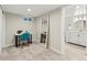 Finished basement bedroom featuring carpet, a desk, a large mirror and a peek into the bathroom at 3052 S Gilpin St, Denver, CO 80210