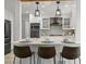 Bright kitchen with stainless steel appliances, breakfast bar, and modern finishes at 3052 S Gilpin St, Denver, CO 80210