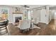 Bright living room featuring a fireplace, wood floors, and sliding barn doors for a rustic modern charm at 3052 S Gilpin St, Denver, CO 80210