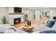 Inviting living room showcases a white brick fireplace, modern decor, and comfortable seating at 3052 S Gilpin St, Denver, CO 80210