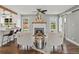 Cozy living space featuring a fireplace, hardwood floors, and access to the outdoors at 3052 S Gilpin St, Denver, CO 80210