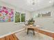 Bright office with hardwood floors, two windows, and a modern desk for a productive workspace at 3052 S Gilpin St, Denver, CO 80210