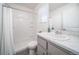 Clean bathroom with a modern vanity, shower, and bright white fixtures at 46533 Avery Ln, Bennett, CO 80022