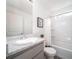 Well-lit bathroom featuring a shower-tub combination and stylish vanity at 46533 Avery Ln, Bennett, CO 80022
