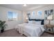 Cozy bedroom with a comfortable bed, plush pillows, and bright natural lighting at 46533 Avery Ln, Bennett, CO 80022