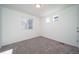 Bright and spacious bedroom with plush carpet and ample natural lighting at 46533 Avery Ln, Bennett, CO 80022