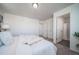 Spacious bedroom featuring neutral paint, plush carpet, and a connected ensuite bathroom at 46533 Avery Ln, Bennett, CO 80022