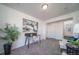 Cozy home office setup with modern desk, accent chair, and natural light, perfect for remote work at 46533 Avery Ln, Bennett, CO 80022