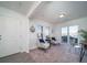 Bright living room featuring two accent chairs, large windows, and an open layout for easy entertaining at 46533 Avery Ln, Bennett, CO 80022
