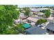 Aerial view features neighborhood homes with green lawns and covered outdoor parking at 1741 W 55Th Pl, Denver, CO 80221
