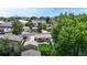 Aerial view of neighborhood homes showcases mature trees and nearby city views at 1741 W 55Th Pl, Denver, CO 80221