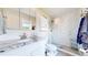 Well-lit bathroom with sleek vanity and glass enclosed shower at 1741 W 55Th Pl, Denver, CO 80221