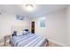 Bright bedroom featuring a comfortable bed, stylish pillows, and natural light at 1741 W 55Th Pl, Denver, CO 80221