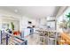 Bright kitchen with white cabinets, granite countertops, and stainless steel appliances at 1741 W 55Th Pl, Denver, CO 80221