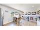 Eat-in kitchen area featuring modern appliances and an open layout at 1741 W 55Th Pl, Denver, CO 80221