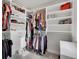 Walk-in closet with custom shelving and ample storage space for clothing and accessories at 8211 Monte Vista Cir, Littleton, CO 80125