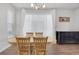Bright dining area featuring a wooden table with seating for four, and natural lighting at 8211 Monte Vista Cir, Littleton, CO 80125