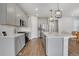 Stylish kitchen showcasing gray cabinets, stainless steel appliances, and a well-lit design at 8211 Monte Vista Cir, Littleton, CO 80125