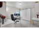Bright office space featuring a modern desk setup with dual monitors and stylish sliding barn doors at 8211 Monte Vista Cir, Littleton, CO 80125