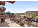 Wide balcony view overlooking parking, landscaping, and city buildings at 1435 Wazee St # 305, Denver, CO 80202
