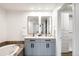 Modern bathroom features a double vanity, soaking tub, and ample storage space for a spa-like experience at 1435 Wazee St # 305, Denver, CO 80202
