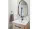 Modern bathroom vanity with sleek faucet, mirror, and towel ring at 1435 Wazee St # 305, Denver, CO 80202