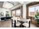 Stylish dining room with exposed brick, large windows, and a cozy fireplace creating a warm and inviting atmosphere at 1435 Wazee St # 305, Denver, CO 80202