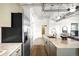 Modern kitchen with stainless steel appliances, stylish countertops, and exposed ductwork at 1435 Wazee St # 305, Denver, CO 80202