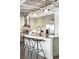 Modern kitchen features a large island, stainless steel appliances, and unique pendant lighting for a chef-inspired culinary experience at 1435 Wazee St # 305, Denver, CO 80202