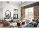 Comfortable living room featuring a fireplace, exposed brick wall and comfortable seating area at 1435 Wazee St # 305, Denver, CO 80202