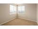 Bright, carpeted bedroom featuring two windows that provide natural light at 22675 E Ontario Dr # 202, Aurora, CO 80016