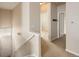 Upper level hallway featuring neutral tones, carpet flooring, and access to bedrooms at 22675 E Ontario Dr # 202, Aurora, CO 80016