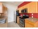 Cozy kitchen featuring stainless steel appliances and efficient layout for cooking convenience at 22675 E Ontario Dr # 202, Aurora, CO 80016