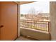 Patio with iron railing overlooking street with bare trees at 22675 E Ontario Dr # 202, Aurora, CO 80016