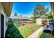 Backyard with an enclosed area, wood fence, a tool shed, and ample green space at 2268 Jay St, Edgewater, CO 80214