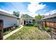 Exterior backyard view with healthy, green grass and a utility shed at 2268 Jay St, Edgewater, CO 80214