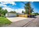 Exterior view showcasing a detached garage with a large driveway and ample parking space at 2268 Jay St, Edgewater, CO 80214