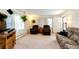 Cozy living room with carpet, natural light, sofa, recliner seating, and plants at 2268 Jay St, Edgewater, CO 80214