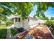 Exterior view of a home featuring a well-maintained side yard with decorative rocks and greenery at 2268 Jay St, Edgewater, CO 80214