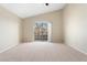 Spacious bedroom featuring vaulted ceilings and large sliding glass doors to balcony at 8623 E Dry Creek Rd # 423, Englewood, CO 80112