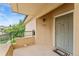 A tan exterior with a locked gray door, black mail box, and a welcome mat at 8623 E Dry Creek Rd # 423, Englewood, CO 80112
