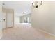 View of the living room that looks out to the patio doors, as well as the front entrance at 8623 E Dry Creek Rd # 423, Englewood, CO 80112