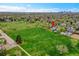Aerial view of the home near a large park, highlighting its location with city skyline view at 215 Jay St, Lakewood, CO 80226