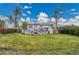 Backyard featuring a deck, patio, and well-maintained lawn at 215 Jay St, Lakewood, CO 80226