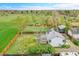 Aerial view of home's extensive fenced backyard, including lawn, firepit, and potential for outdoor living at 215 Jay St, Lakewood, CO 80226