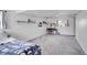 Finished basement bedroom with neutral paint, carpet, desk, shelving and great natural light at 215 Jay St, Lakewood, CO 80226