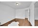 Empty bedroom with neutral walls, hardwood flooring and mirrored closet at 215 Jay St, Lakewood, CO 80226