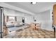 Open concept living area with tile flooring, neutral paint, and a large comfortable sofa at 215 Jay St, Lakewood, CO 80226